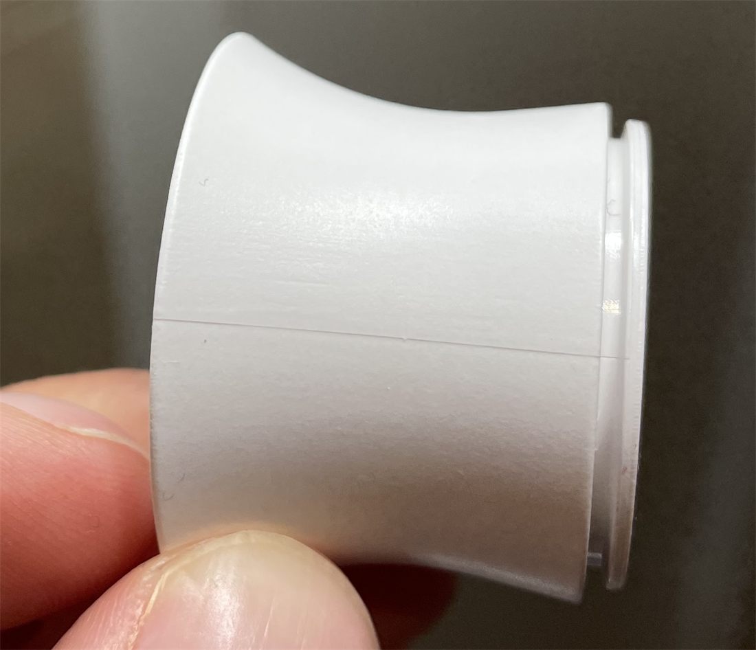 Split line of a round injection molded design